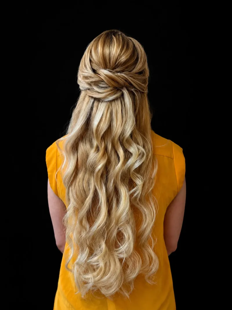 Elegant French twist updo with gold accents